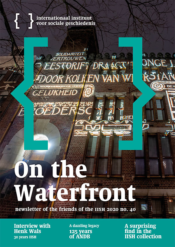 Cover of On the Waterfront 40. Nocturnal photo of the light projection of a historical image on the façade of the union building De Burcht in Amsterdam in December 2019.