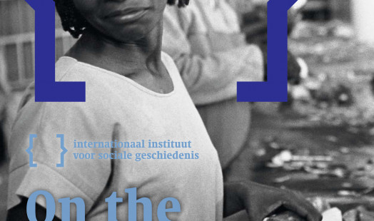 Cover of On the Waterfront 37. Cover of On the Waterfront 37. Black-and-white photograph of a woman wearing a Rasta hat working on an assembly line in a frozen food factory in Tsumeb, Namibia, in 1997.